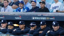 LOS ANGELES, CALIFORNIA - OCTOBER 25: (L-R) Jim Gentleman, Jimmy Kimmel and Cleto Escobedo III watch during Game One of the 2024 World Series between the Los Angeles Dodgers and the New York Yankees at Dodger Stadium on October 25, 2024 in Los Angeles, California. (Photo by Kevork Djansezian/Getty Images)