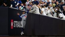 NEW YORK, NY - OCTOBER 29:  Mookie Betts #50 of the Los Angeles Dodgers makes a leaping catch against the wall during Game 4 of the 2024 World Series presented by Capital One between the Los Angeles Dodgers and the New York Yankees at Yankee Stadium on Tuesday, October 29, 2024 in New York, New York. (Photo by Daniel Shirey/MLB Photos via Getty Images)